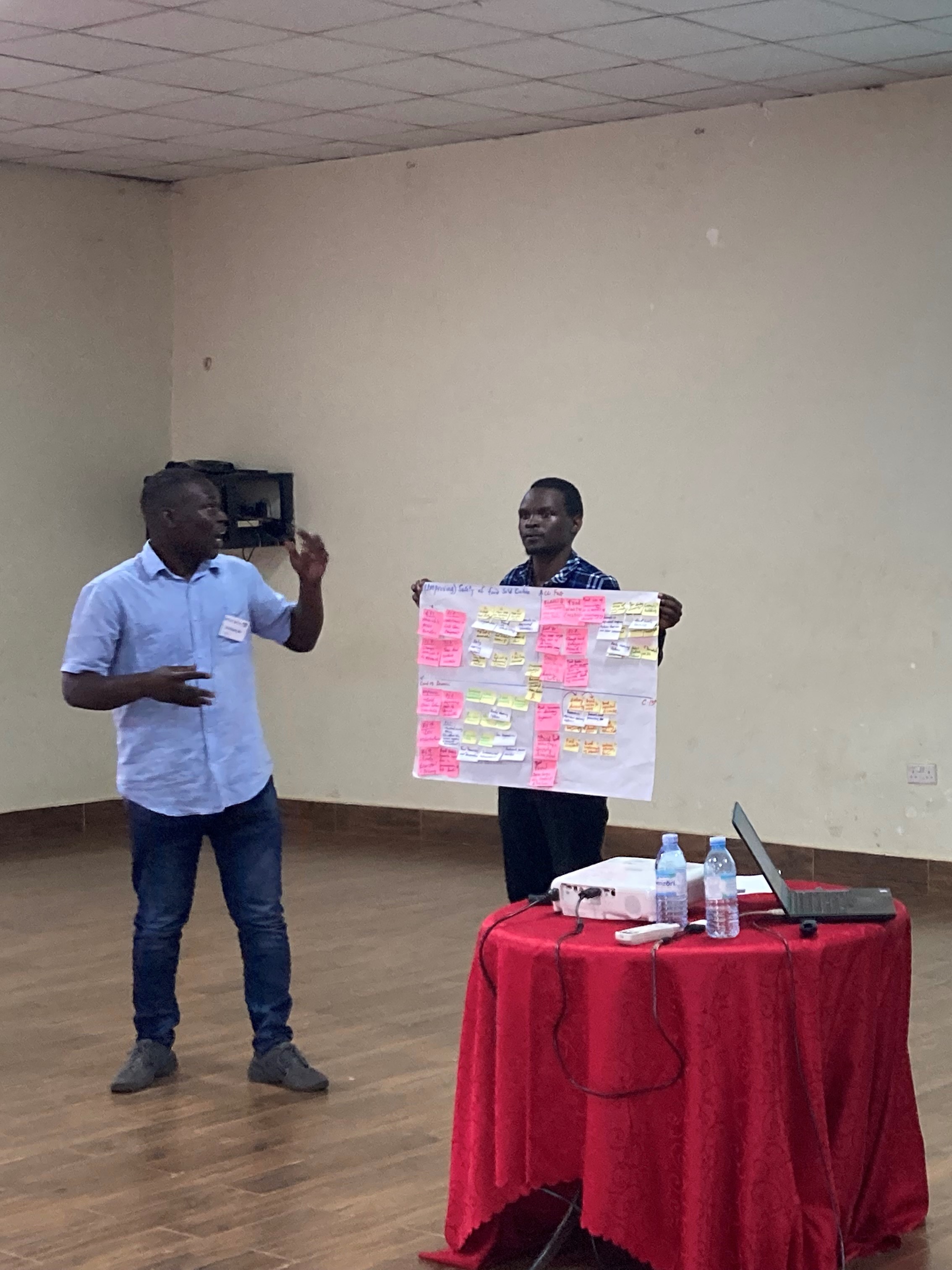 Two participants on the IFSTAL course at Makerere University, Kampala do a presentation.